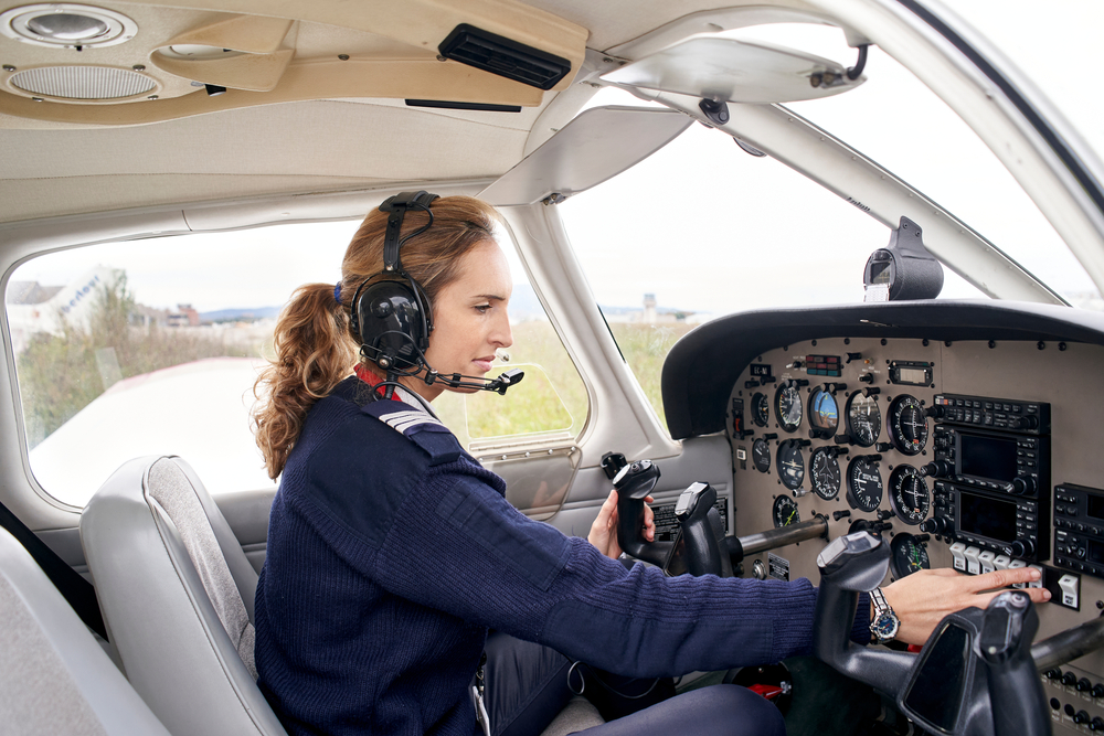 Female pilot in cockpit